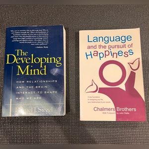 2 used paperback books, good condition